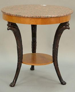 Baker round marble top table with bird heads and paw feet. ht. 31in., dia. 30in.