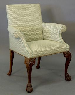 Chippendale style upholstered armchair with hairy paw feet.