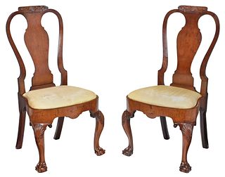 A Pair of George I Carved and Figured Walnut Compass Seat Side Chairs