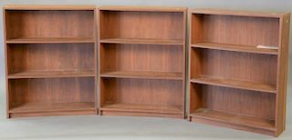 Three Scandinavian teak or walnut bookcases, Hvidt style. ht. 46in., wd. 32in., dp. 10in.