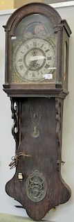 Early hanging wall clock with moon phase dial, early 19th century (now fitted with electric works). ht. 50in., wd. 14in.