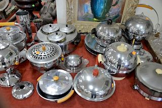 Eighteen piece group of art deco chrome serving pieces including chase chrome pieces chafing dish hot plate condiment steamer