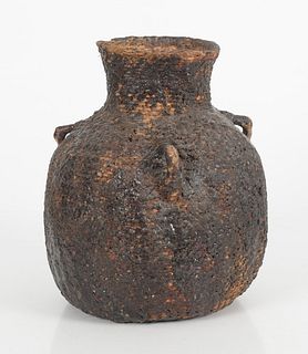 A Large Apache Pitch Covered Water Jug