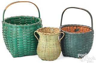 Three small green painted baskets