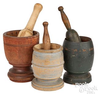 Three turned and painted mortar and pestles