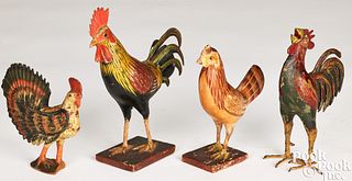 Four carved and painted roosters, late 19th c.
