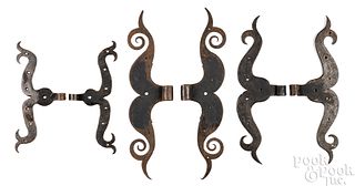 Three pairs of wrought iron ram's horn hinges