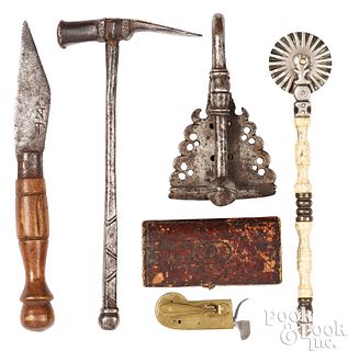 Group of iron, brass, and leather accessories