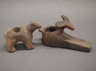 2 clay effigy pipes