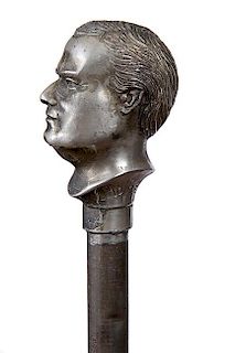 14. William McKinley Political Cane- Ca. 1885- A McKinley figural handle which is done in a white metal and the collar is cas
