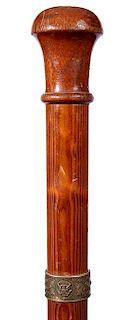 16. White House Relic Cane- Ca. 1950- A carved one-piece pine walking stick which has a bronze plaque with the Presidential e