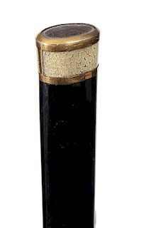 29.Ebony and Shagreen Dress Cane- Ca. 1920- An unusual art deco gold dress cane with two shagreen inserts, gold is not signed