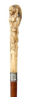 47. Japanese Monkey Cane- Ca. 1890- A mother and child monkey playing carved in high relief on a stag handle, saw blade white