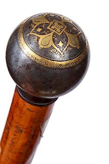 44. Toledo Dress Cane- Ca. 1880- A large Toledo ball handle with nice mixed metal decoration atop, malacca shaft and a worm e