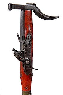 65. Gun/Sword Cane- Mid 19th Century- An unusual flintlock pistol in working condition which doubles as the handle for this p