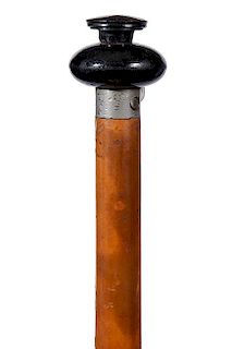 71. Gun Cane- Ca. 1885- A needle fire gun cane with a horn handle which is about a 20 caliber, the shaft separates to load th