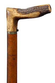 74. Dumonthier Gun Cane - Pat. 1878- A signed example of a fine shotgun cane with a stag handle and a full malacca shaft, pus