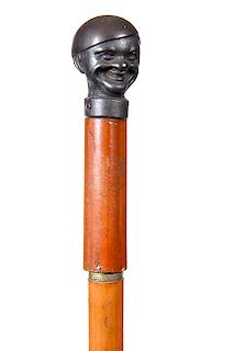 88. Iron Sword Cane- Ca. 1880- A cast iron handle in the shape of a man with a smile from ear to ear, a push and pull 13  ½