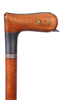 99. Shotgun Cane- Ca. 1880- A Belgium shotgun cane in working condition with matching serial numbers, walnut handle with a wo