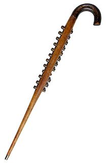 109. Harmonica/Pitch Pipe Cane- Ca. 1850- A handmade harmonica style cane with 12 chambers, with 10 of them still working, th