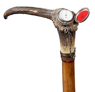 115. Physician’s System Cane- Ca. 1865- A large stag handle with a hinged pomander compartment atop, with a small silver st