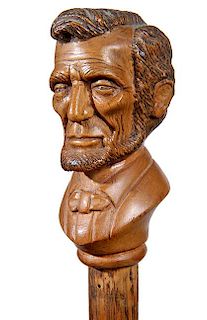 163.  Abraham Lincoln Folk Cane- Ca. 1900- A great likeness of president Lincoln with colored hair and beard, a pair of lanya