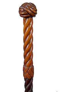 167. Nautical Carved Cane- Ca. 1850- the handle is a carved Turk’s knot, spiral carved shaft with a carved woven collar and