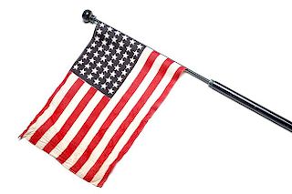 187. American Flag Parade Cane- Early 20th Century- A 48 star flag with original decal “A.B. Madden Specialties, Detroit, N