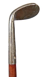 196. Golf Sunday Stick Cane – Ca. 1910 – A Sunday cane in the shape of an iron which is solid cast, exotic wood shaft and