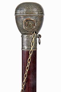 194. Torch/Lighter Cane – Ca. Late 19th Century – A silver mounted working torch/lighter cane, the hand worked silver met