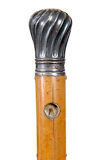 197. Holuska Watch Cane- 19th Century- A nice example of this well known watch cane with a silver handle which doubles as the