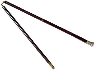 208. Silver Suitcase Cane – Ca. 1910 – A traveling cane which unscrews at the center of the shaft and breaks down for an 