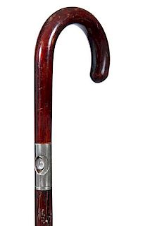216. Flashlight Cane – Ca. 1925 – A crook hardwood flashlight system cane with original bulb and clean battery compartmen