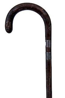 226. Defensive Flange Cane – Ca. 1925 – A hardwood crook handle which retracts from the hardwood shaft and a metal and sp