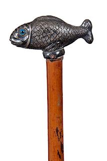 229. Koi Dress Cane – Ca 1900 – A beautifully cast silver plate fish with blue and black eyes, unreadable British hallmar