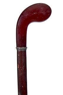 233. Bakelite Dress Cane – Ca. 1925 – A beautiful cherry amber Bakelite handle in the form of a pistol grip, small ornate