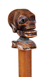 248. Automation Skull Cane – Ca. 1885 – A carved skull which is hinged from the upper section and opens probably to doubl
