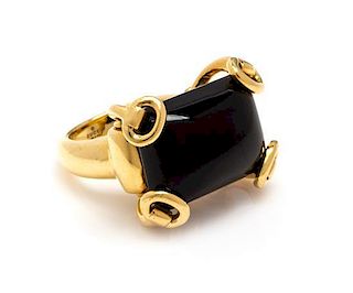 An 18 Karat Yellow Gold and Onyx "Horsebit" Ring, Gucci, 17.70 dwts.