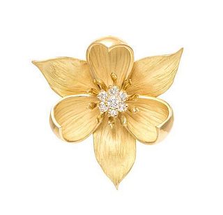* An 18 Karat Yellow Gold and Diamond Camellia Brooch, 15.20 dwts.
