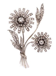A White Gold, Silver Topped Gold and Diamond Flower Brooch, 20.20 dwts.