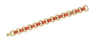 * An 18 Karat Yellow Gold and Coral Link Bracelet, 21.10 dwts.