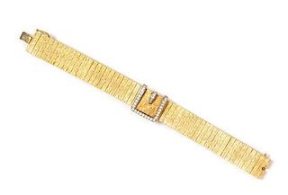 * A 14 Karat Yellow Gold and Diamond Surprise Wristwatch, Baume & Mercier, 33.00 dwts.