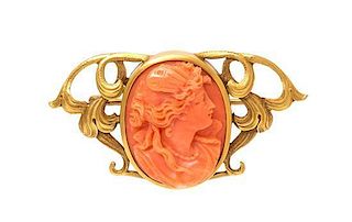 An Art Nouveau Yellow Gold and Coral Cameo Brooch, 6.40 dwts.