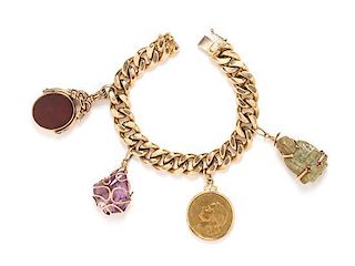 * A Yellow Gold Bracelet with Four Attached Charms, 95.90 dwts.