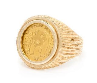 * A 14 Karat Yellow Gold and Chinese Gold Coin Ring, 5.45 dwts.