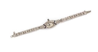 An Art Deco Platinum, Diamond and Synthetic Sapphire Wristwatch, 17.70 dwts.