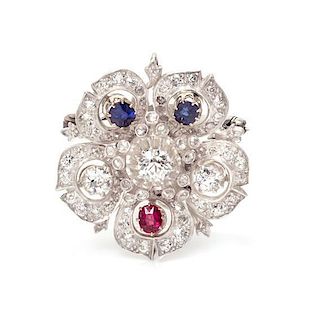 A Silver Topped Gold, Diamond, Ruby and Sapphire Flower Motif Pendant/Brooch, 8.90 dwts.