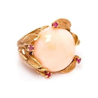 A 14 Karat Yellow Gold, Angel Skin Coral and Ruby Ring, 9.30 dwts.