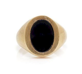 A 10 Karat Yellow Gold and Onyx Signet Ring, 7.80 dwts.