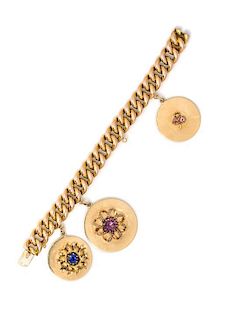 * A 14 Karat Yellow Gold Bracelet with Three Attached Charms, 46.70 dwts.